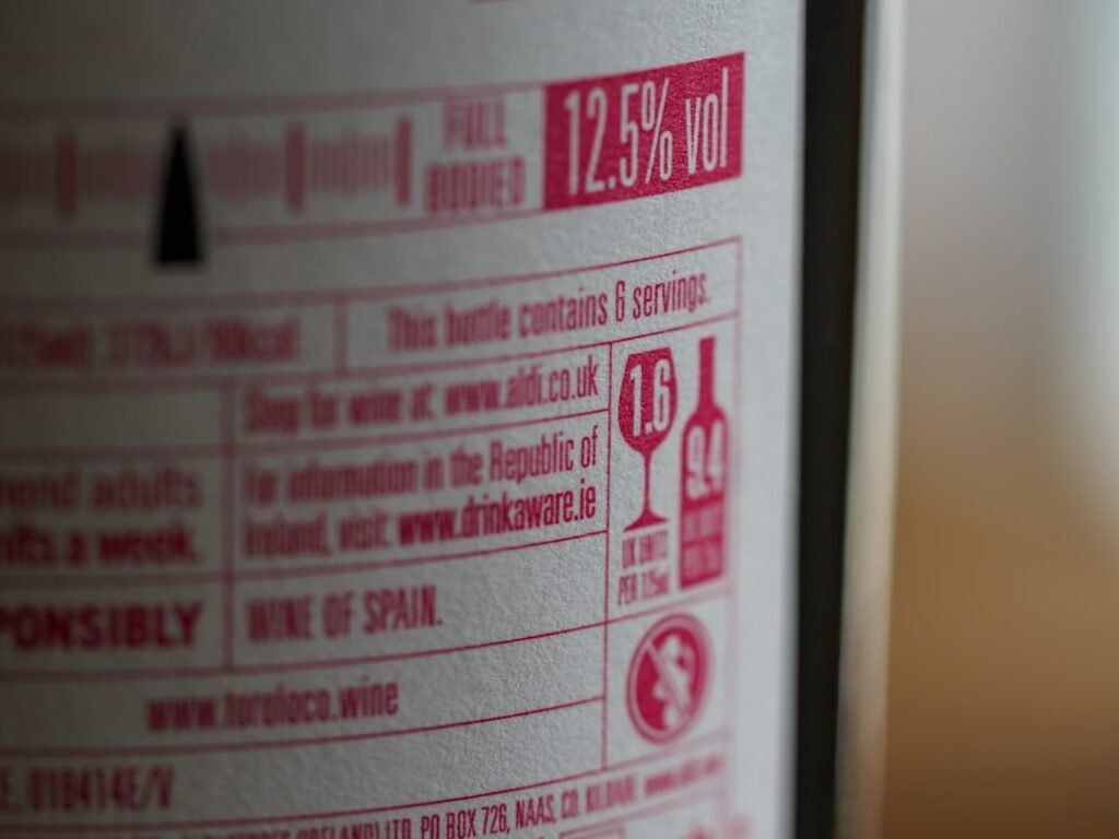 Close-up of a wine bottle label, symbolizing the opacity of wine labeling regulations